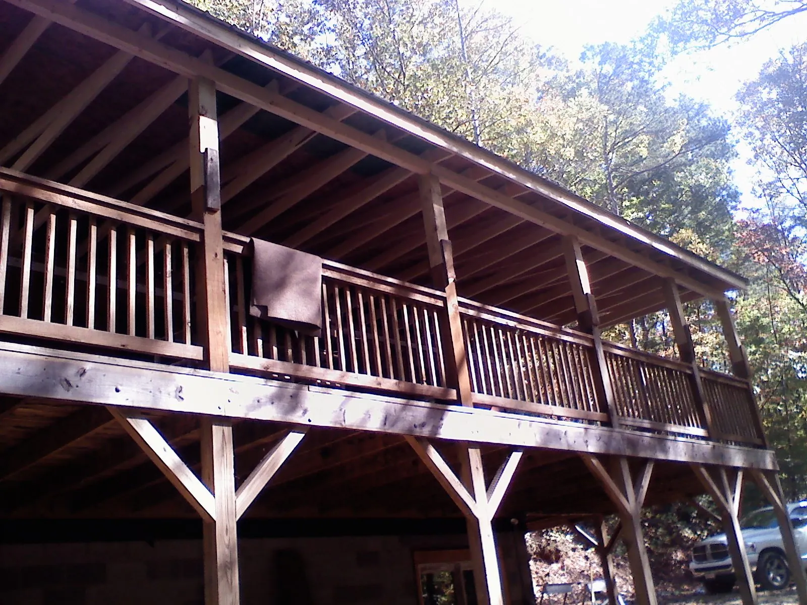 Timber framing under a new elevated porch and deck — Roof Leak Repair in London by Roofing Brothers